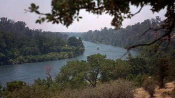 Almost Heroes movie: Scenic landscape view of a large river winding through wooded land on each side