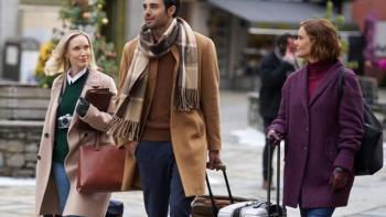 An Alpine Holiday movie: Two sisters and a man walk through a town carrying luggage