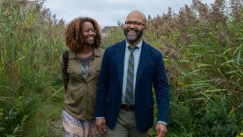 American Fiction Movie: Erika Alexander and Jeffrey Wright smile as they walk outdoors