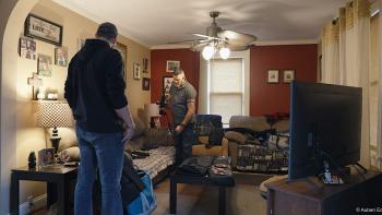 An American Pastoral movie: James Emery surveys his guns laid out on his couch at home