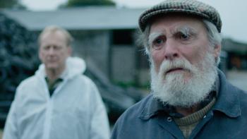 And Then Come the Nightjars: Nigel Hastings in a white hazmat suit, David Fielder with a white beard looks sad