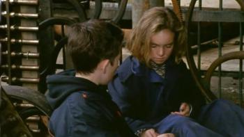 An Angel for May: Tom looks at May as the two sit in a barn together 