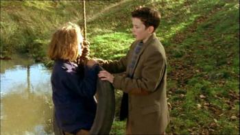 An Angel for May: Tom talks to May as she sits in a tyre swing