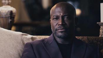 Another Man’s Wife movie: Taye Diggs sits on a couch wearing a suit