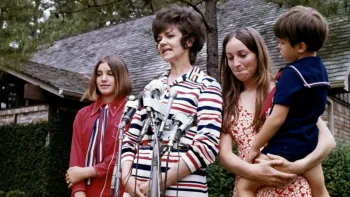 Apollo 13: Survival: Marilyn Lovell and children address the press outside their home.