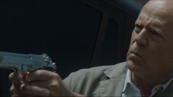 Assassin Movie: Bruce Willis points a gun toward the left side of the frame