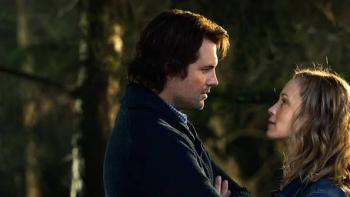 Atlas Shrugged III: Man and woman gazing at each other in a forest setting.