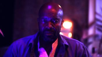 Atrabilious movie: Leon Addison Brown stares at himself amid purple lighting 