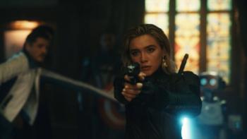 Avengers: Doomsday Movie: Woman aims a gun in a dimly lit room