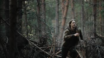 Azrael Movie: A terrified Azrael (Samara Weaving) runs through the woods