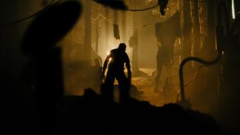 Azrael Movie: A monstrous figure in silhouette lurks threateningly through a campsite