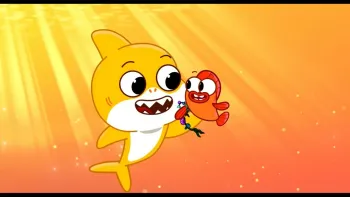 Baby Shark's Big Movie: Colorful image of a yellow baby shark smiling with a colorful red fish