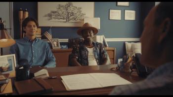Bad Counselors movie: Matt Cornett and Ramon Reed sit at a desk facing Chris Klein