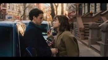 Bad Shabbos: A man and woman talk closely outside a car
