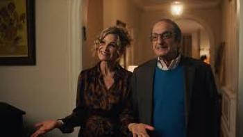 Bad Shabbos: A man and woman smile and look welcoming