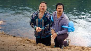 Balls Up: Paul Walter Hauser and Mark Wahlberg wash up on the beach.