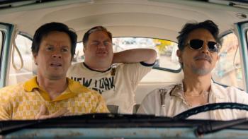 Balls Up: Paul Walter Hauser, Mark Wahlberg, and Benjamin Bratt in a car. 
