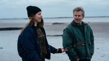 Ballywalter: Seána Kerslake and Patrick Kielty smile as they walk along a beach