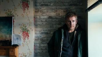 Ballywalter: Patrick Kielty stands against a wall by a living room window looking sad