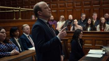 Bank of Dave 2—The Loan Ranger: Rory Kinnear stands in a courtroom, speaking and gesturing with his hand