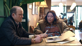 Bank of Dave 2—The Loan Ranger: Rory Kinnear and Chrissy Metz sit at a table together looking through a folder of papers