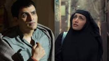 Baramulla: South Asian man looks scared, woman in hijab looks pensive