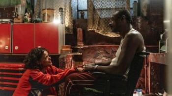 Beast Race: A woman kneels before her father.