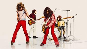Becoming Led Zeppelin: The band performing on white background