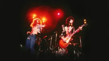 Becoming Led Zeppelin: Robert Plant and Jimmy Page performing in front of red lights