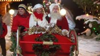 Becoming Santa:  Couple in sleigh with Santa