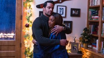 Best. Christmas. Ever!: Matt Cedeño hugs Brandy Norwood.