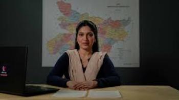 Bhakshak scene 1: Indian woman sits with map behind her