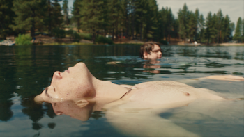 Big Boys: Boys float in the lake.