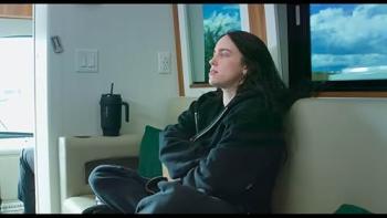 Billie Eilish Hit Me Hard and Soft movie: Eilish sits on a couch, eyes closed, in a hotel room during her concert tour
