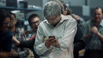 BlackBerry Movie: Jay Baruchel looks at his BlackBerry invention amid a crowd of his employees