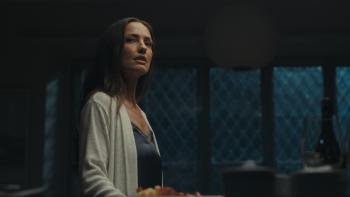 Blackwater Lane Movie: Alone in a dimly lit house, Cass (Minka Kelly) seems startled and on guard about something