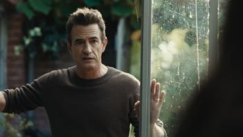 Blackwater Lane Movie: Matthew (Dermot Mulroney) leans on the door of a greenhouse, speaking sternly to an unseen Cass