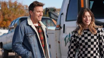 Bleeding Love Movie: Ewan McGregor smiles in a plaid shirt and jean jacket next to his daughter, Clara, in front of a tow truck