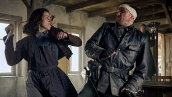 Blood & Gold: White German woman on left rears back knife to strike Nazi officer in bandage wrapped head on right