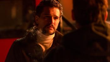 Blood for Dust Movie: In a bar, Ricky (Kit Harington) makes a business proposition to Cliff (whose back is to viewers)