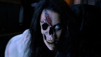 Urban Legend—Bloody Mary: A scary, ghostly figure with a skeletal mouth, scarring on her forehead, and an eye missing stares straight ahead