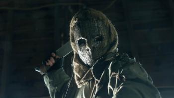 Bloody Axe Wound Movie: A masked killer raises a machete behind his head, as if ready to swing