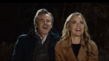 Blue Eyed Girl movie: Marisa Coughlan and Sam Trammell smile while watching fireworks (off camera)