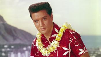 Blue Hawaii: Elvis Presley wears a Hawaiian shirt and a lei against an ocean backdrop