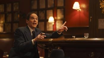 Blue Moon Movie: Lorenz Hart (Ethan Hawke) sits at the bar and talks, gesturing with one hand, and a cigar in the other.