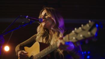 The Easy Kind movie: Elizabeth Cook on stage playing guitar under stage lights
