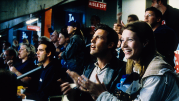Bounce movie: Gwyneth Paltrow smiles and claps next to Ben Affleck, both in a crowded stadium audience