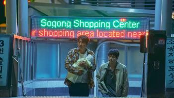 Broker: Two Asian men, one middle-aged and one in his 20s, walk up shopping mall steps with a baby