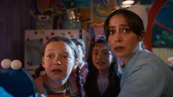Buddy Movie: Two frightened young girls cower near Nurse Grace, who looks on with a worried expression
