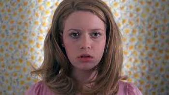 But I'm a Cheerleader Movie: Natasha Lyonne close-up in front of a flowery wallpaper.